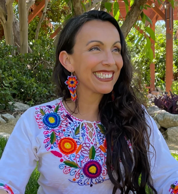 Erika Buenaflor smiling in the garden