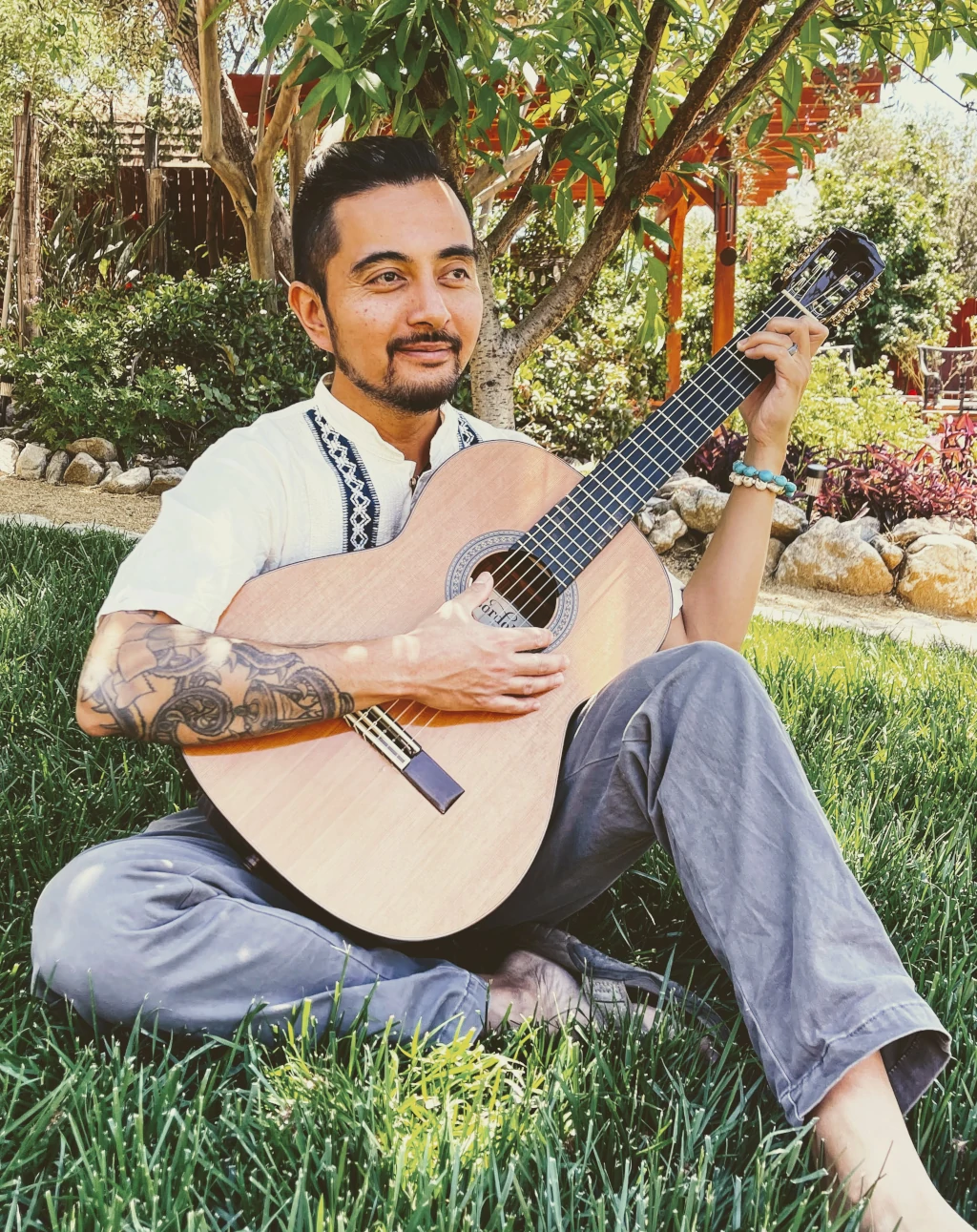 Miguel Buenaflor playing medicine music in the garden