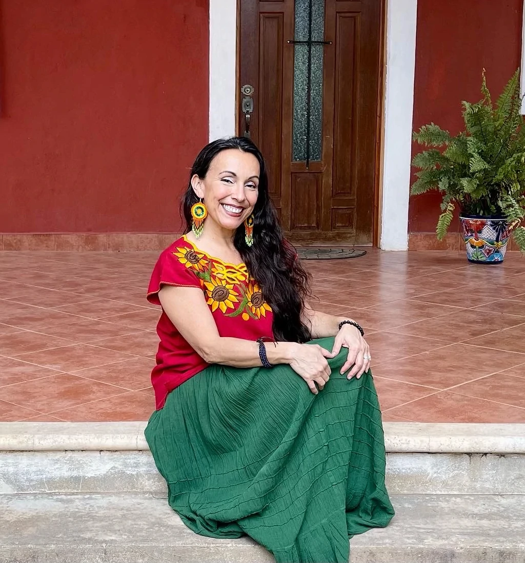 Erika Buenaflor sitting in the front porch after her impeccable recovery from a 2005 catastrophic injury