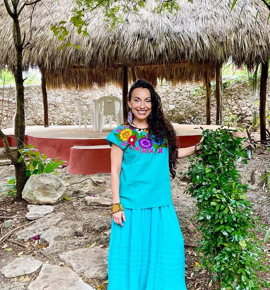 Erika Buenaflor by the palapa began her first business as a consultant/coach and in the healing arts